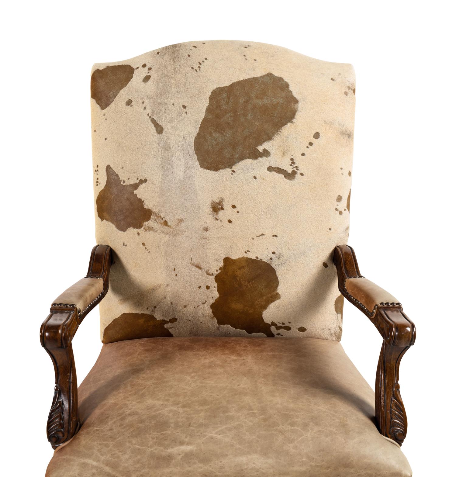 A Pair of Louis XV Style Carved Walnut Fauteuils