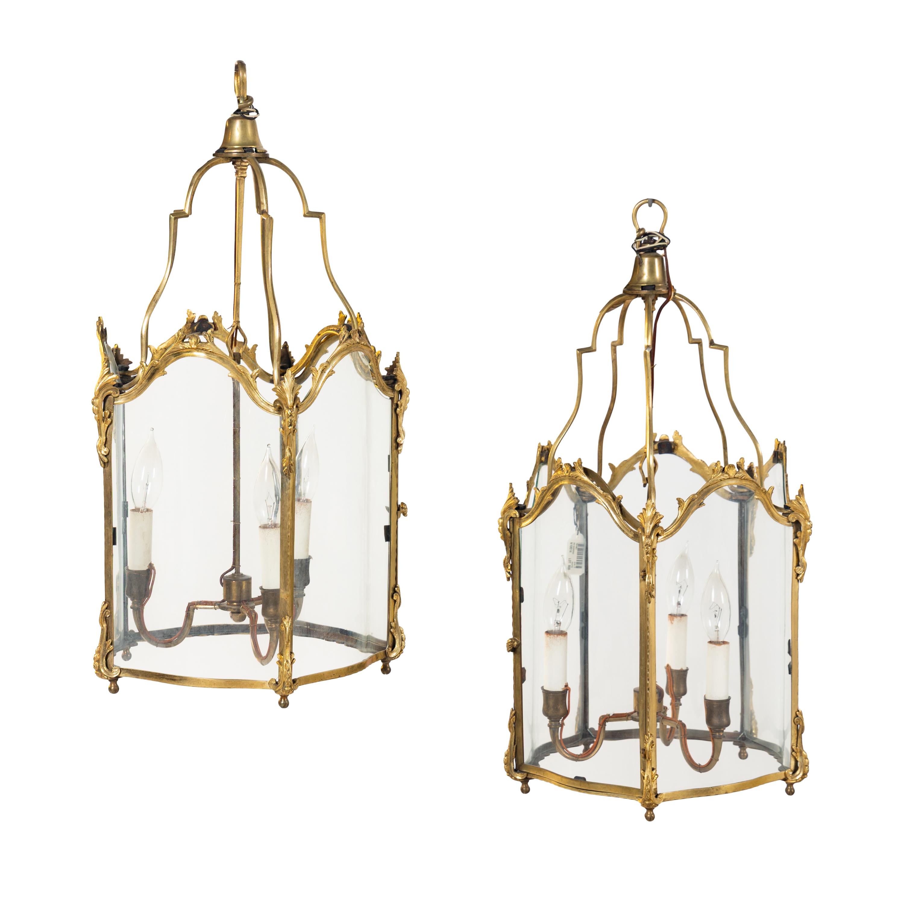 A Pair of Louis XV Style Gilt Bronze Three-Light Hall Lanterns