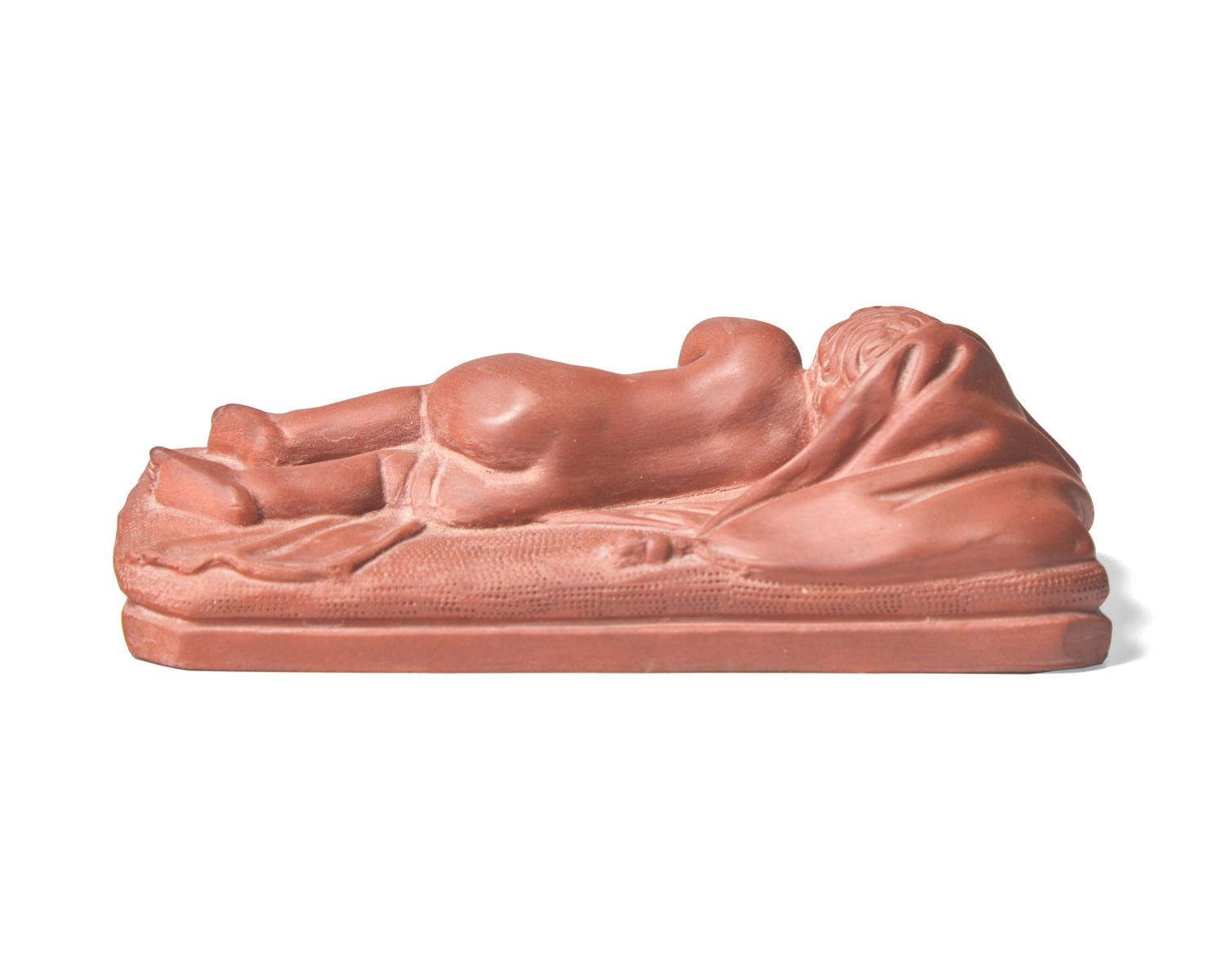 A Wedgwood Rosso Antico Sleeping Baby Figure
