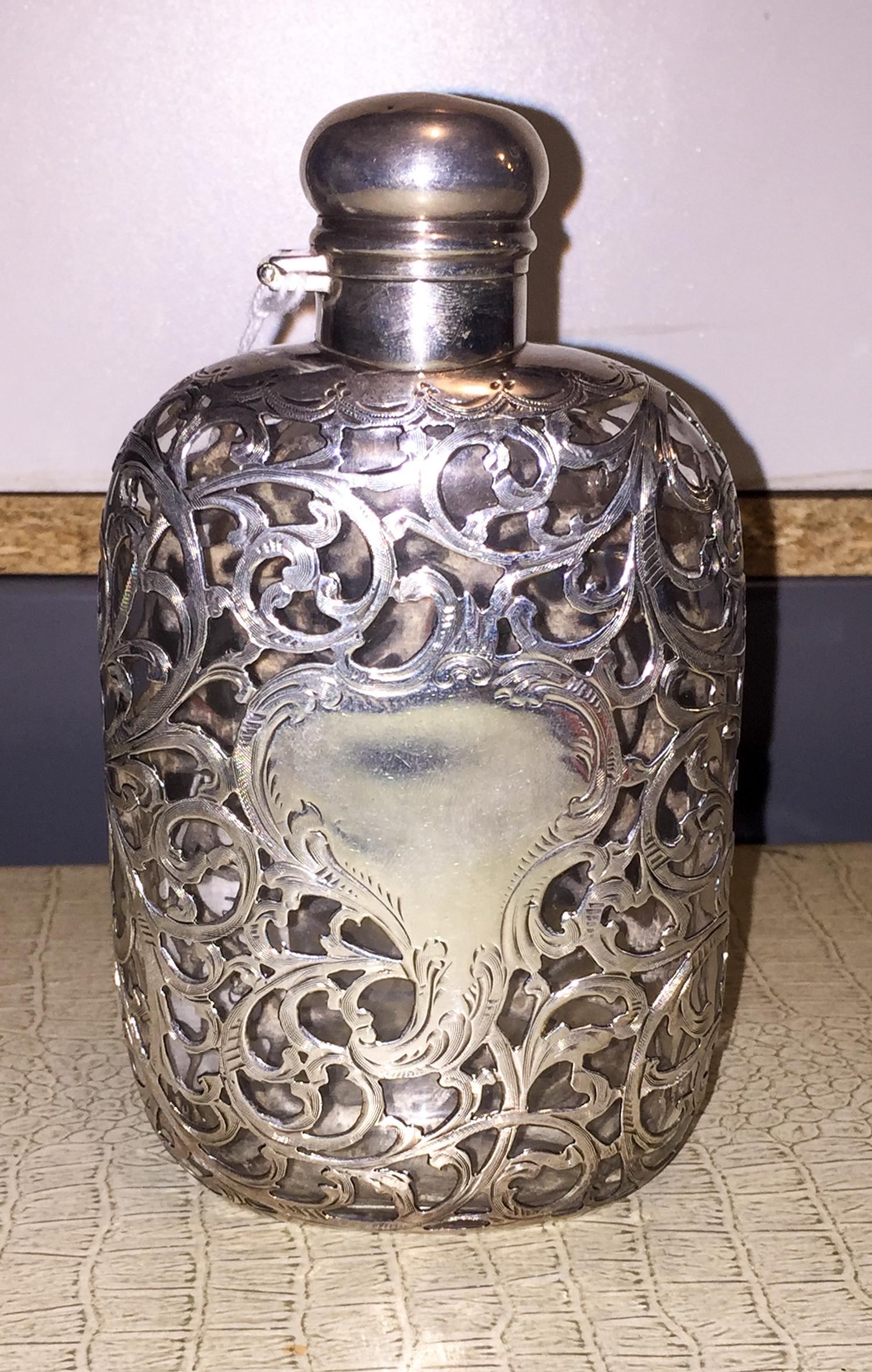 An American Fine Silver Overlay Glass Flask, Alvin Mfg. Co., Providence, RI, with vine and C-scroll decoration with a cartouche having
