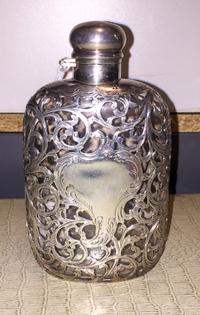 An American Fine Silver Overlay Glass Flask, Alvin Mfg. Co., Providence, RI, with vine and C-scroll decoration with a cartouche having