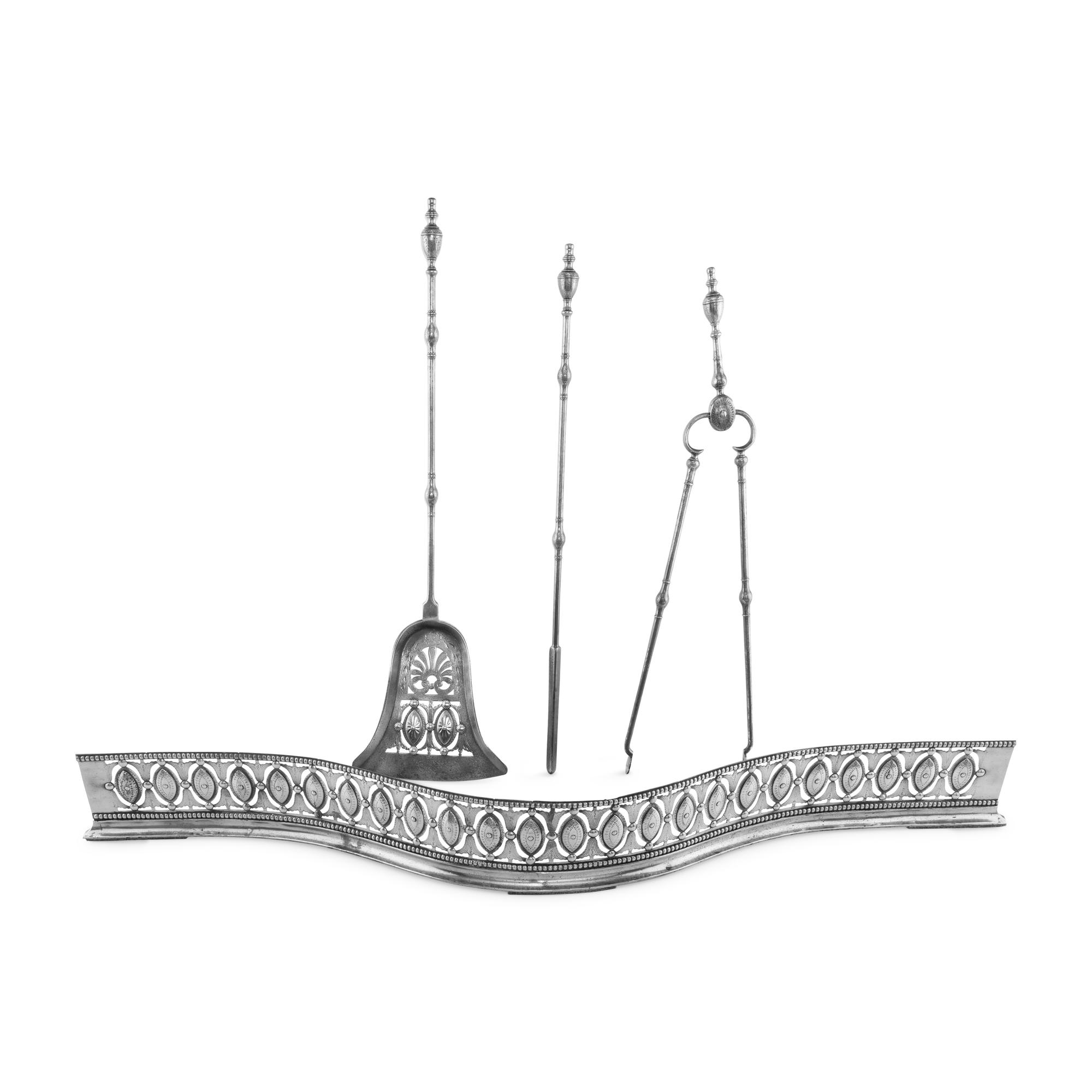 A George III Steel Serpentine Fender and Fireplace Tools