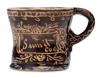 A Slip-Glazed and Incised Mug