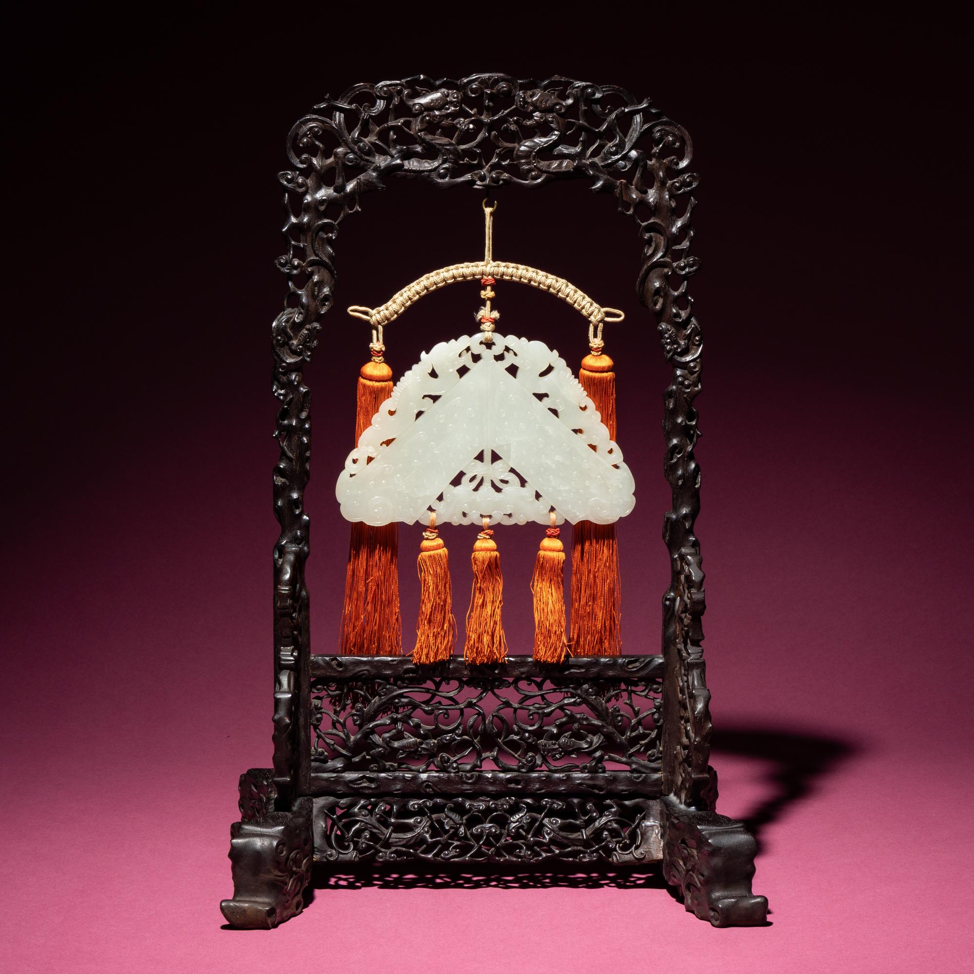 A Chinese White Jade Chime-Form Pendant, 18th/19th Century — 清中期 白玉罄