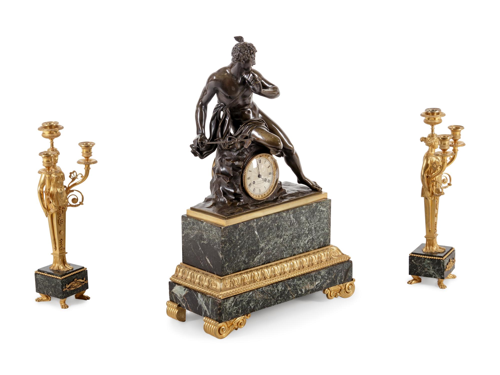 An Empire Style Gilt and Patinated Bronze and Marble Clock Garniture
