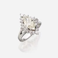 A diamond and eighteen karat white gold ring