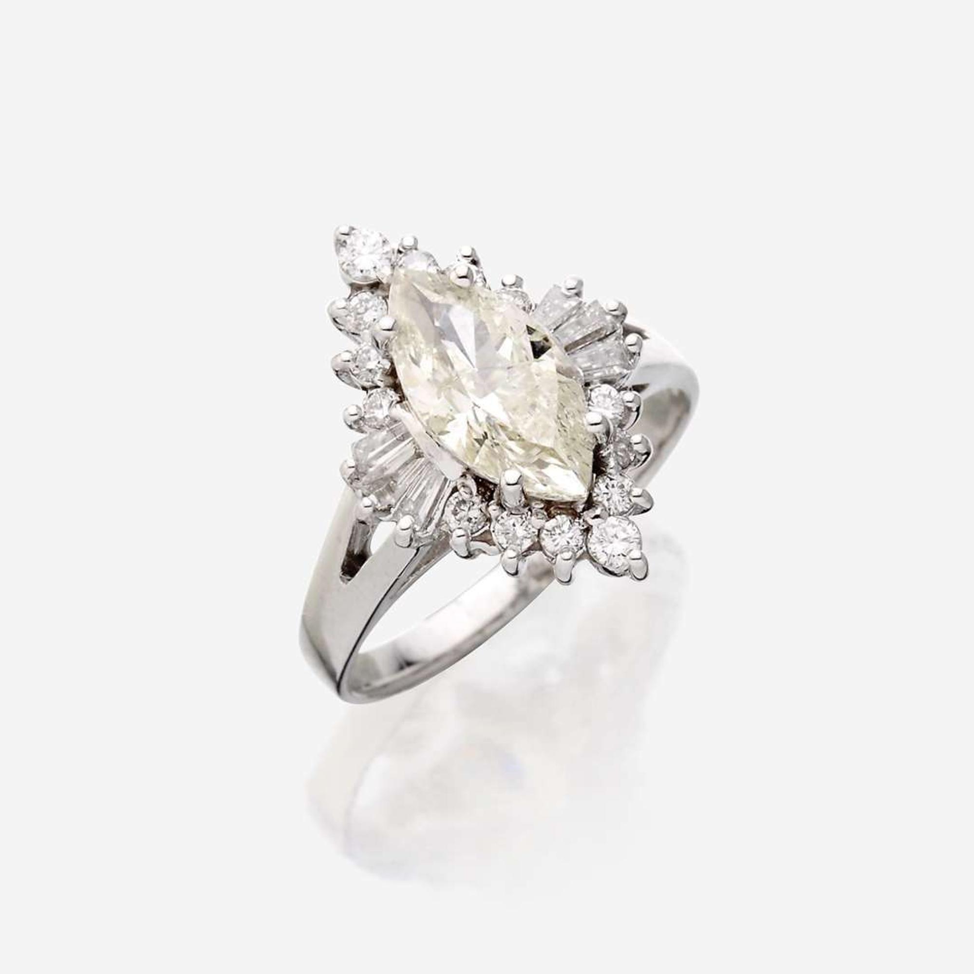 A diamond and eighteen karat white gold ring