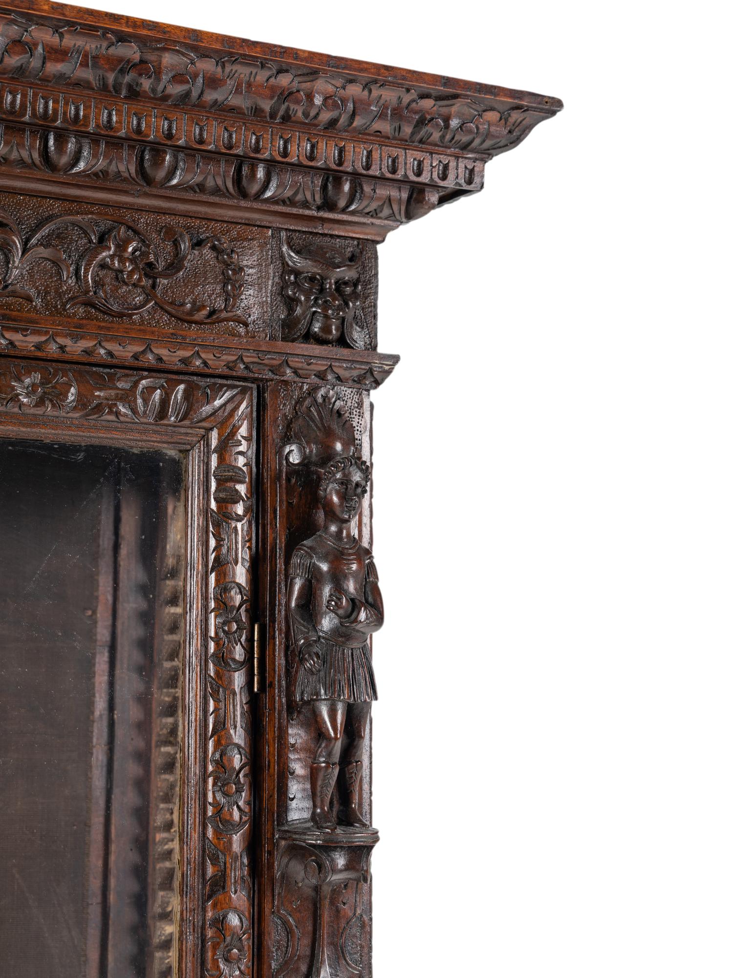 An Austrian Carved Walnut Cabinet