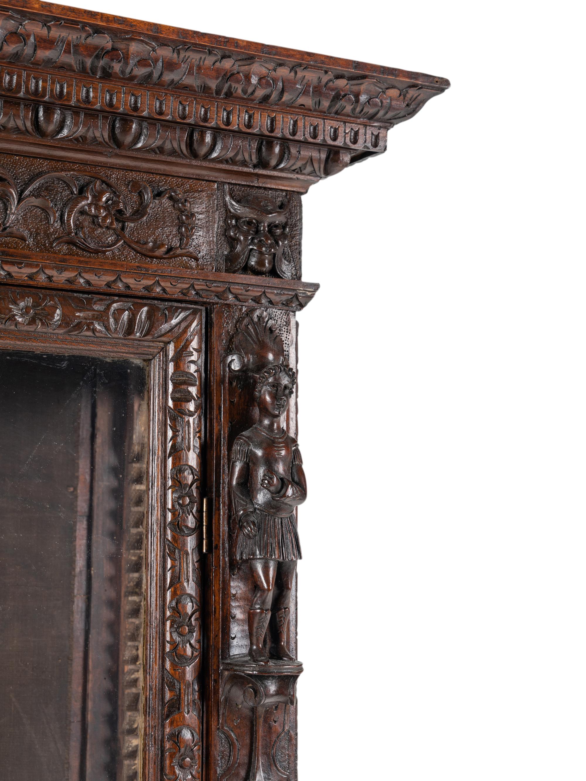An Austrian Carved Walnut Cabinet
