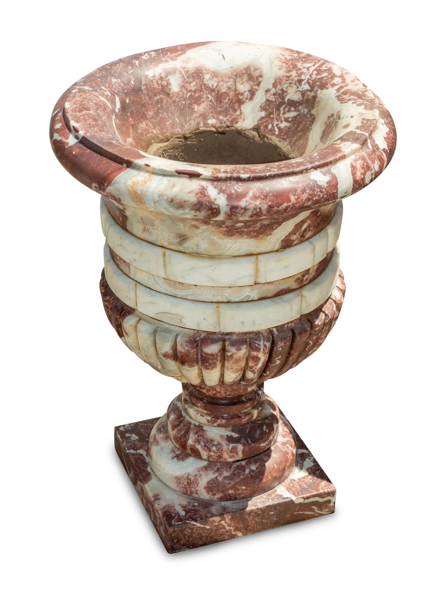 A Set of Four Italian Carved Red and White Marble Urns