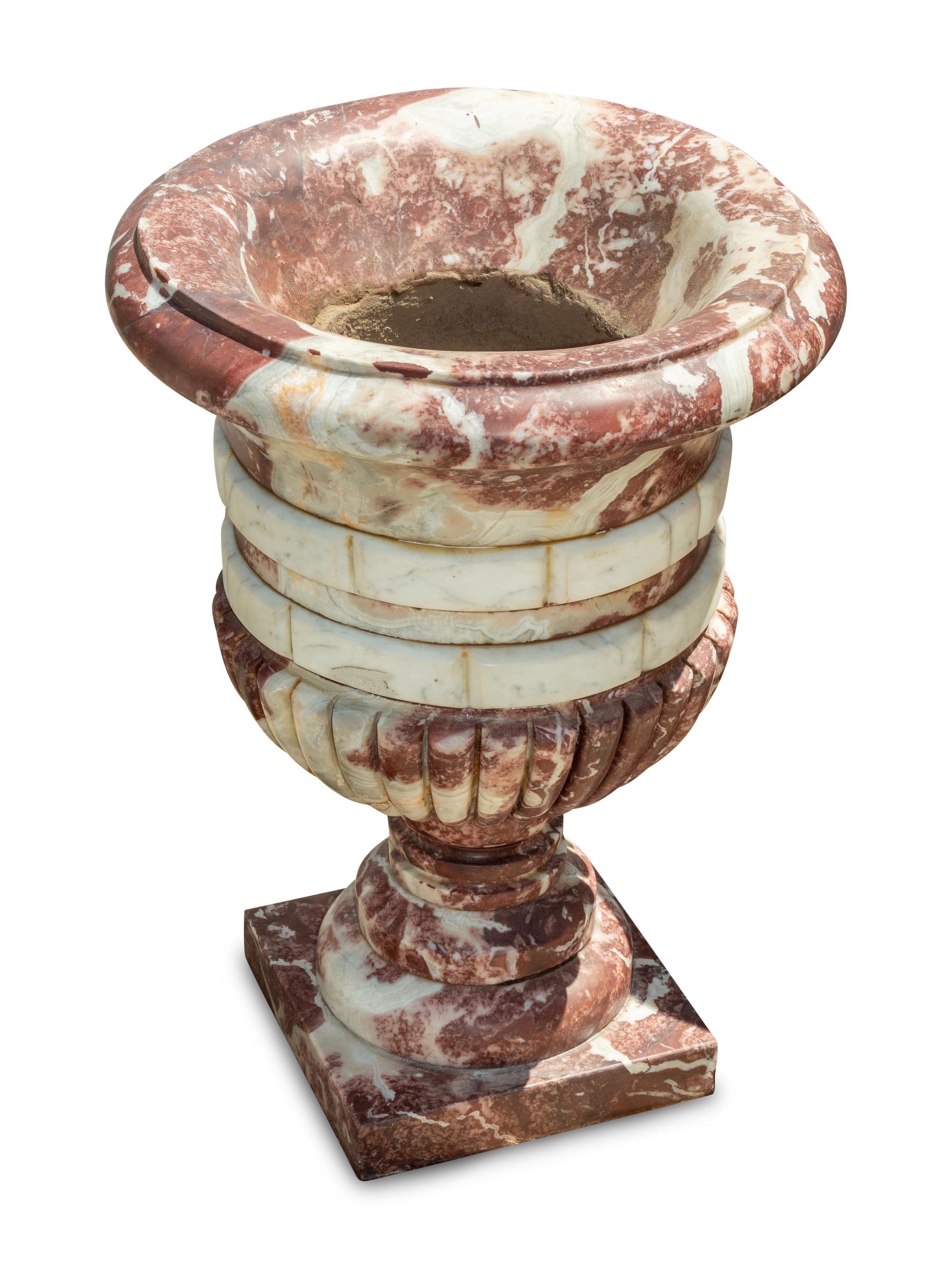 A Set of Four Italian Carved Red and White Marble Urns
