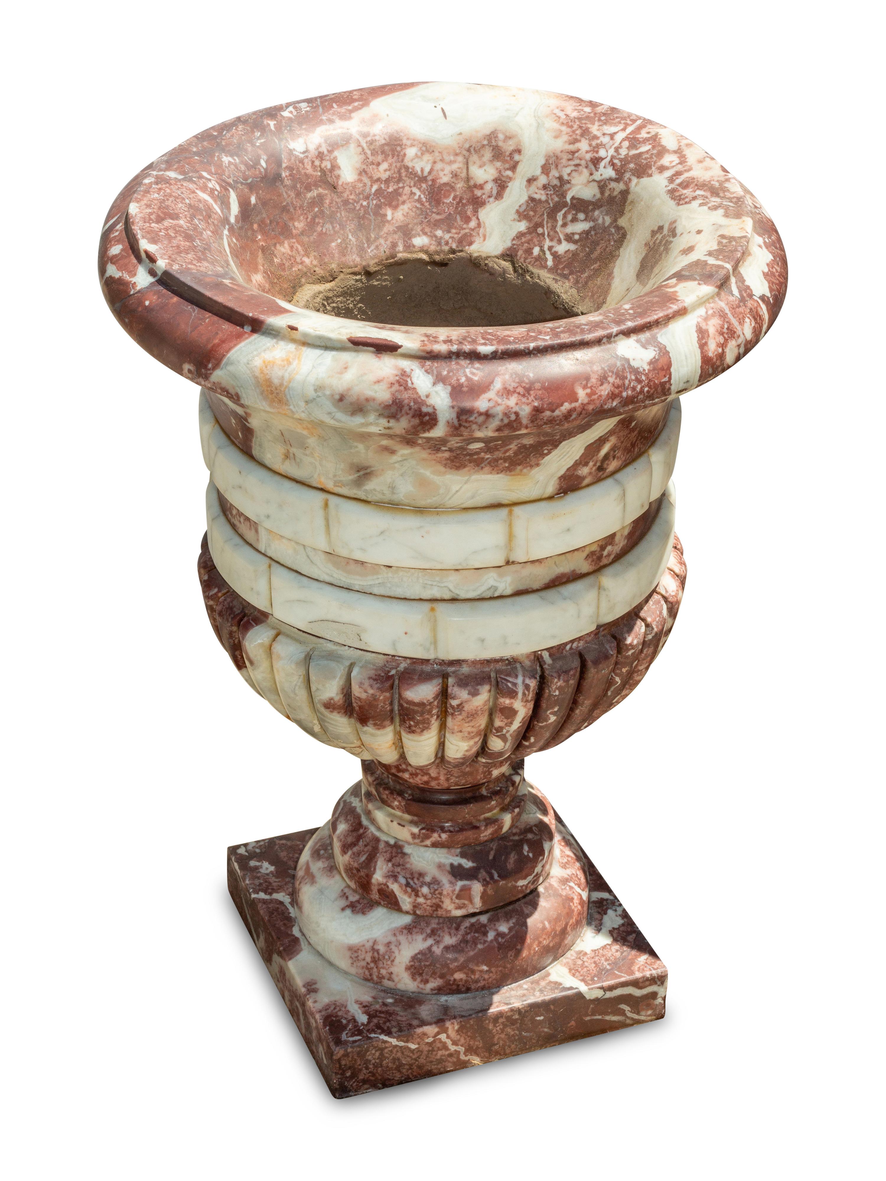 A Set of Four Italian Carved Red and White Marble Urns