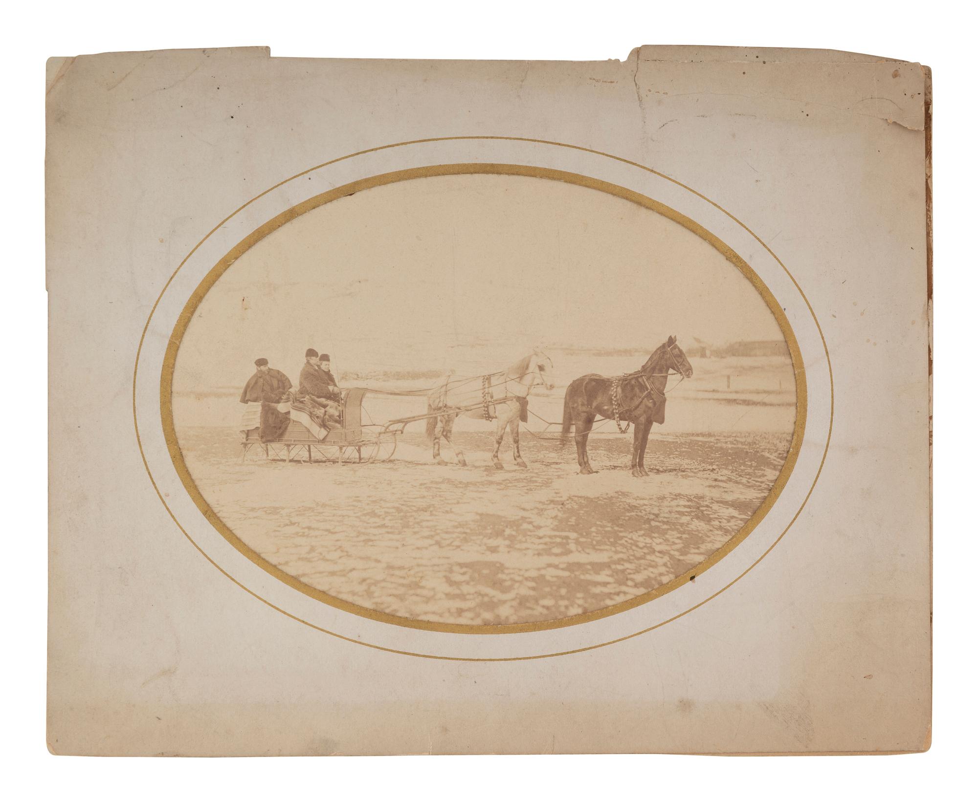 [WESTERN AMERICANA]. Albumen photograph featuring Tom Custer, Nellie Wadsworth, and William W. Cooke on a sleigh ride. Ca 1875.
