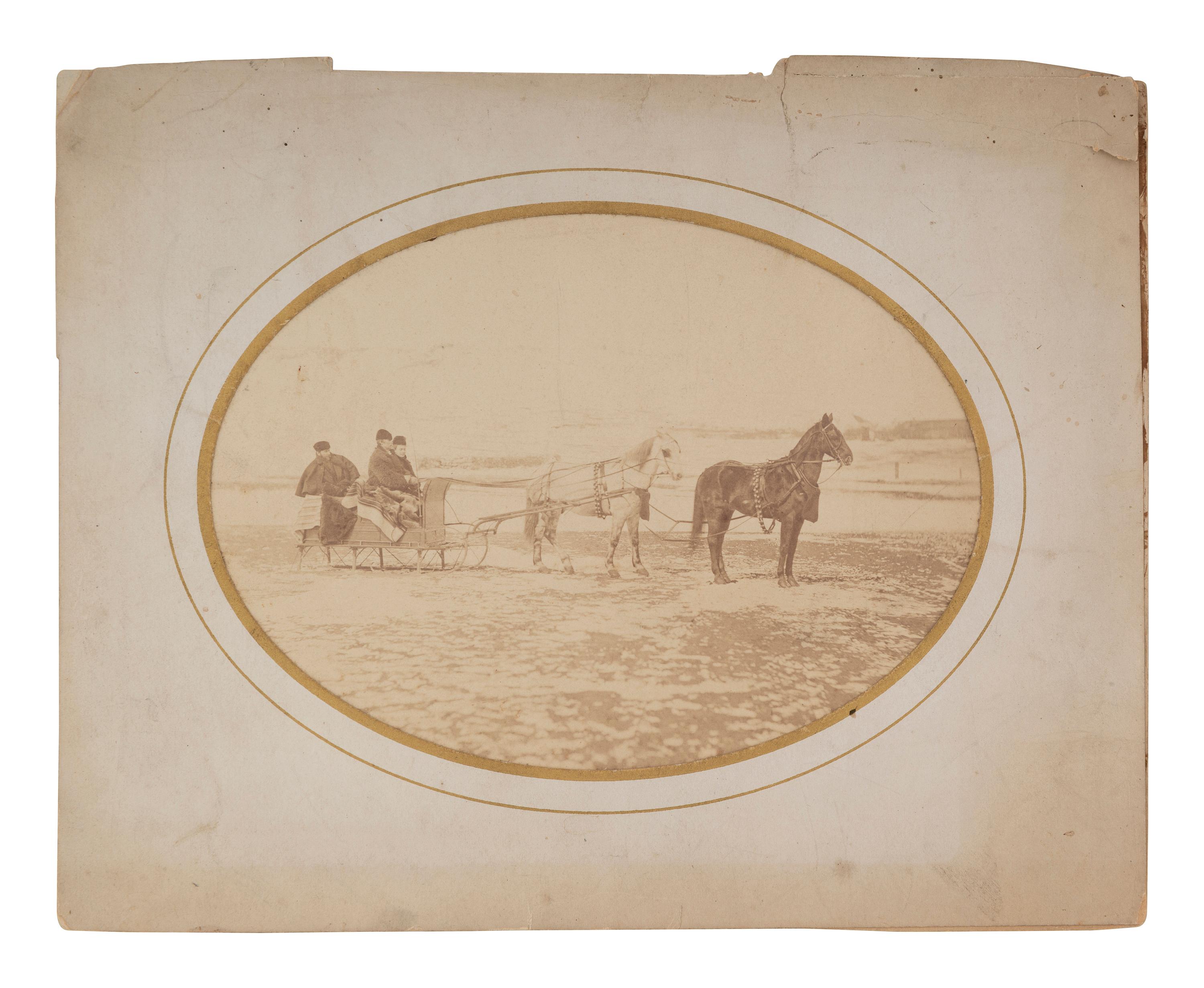 [WESTERN AMERICANA]. Albumen photograph featuring Tom Custer, Nellie Wadsworth, and William W. Cooke on a sleigh ride. Ca 1875.