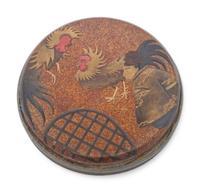 A Gold and Black Lacquer Covered Box