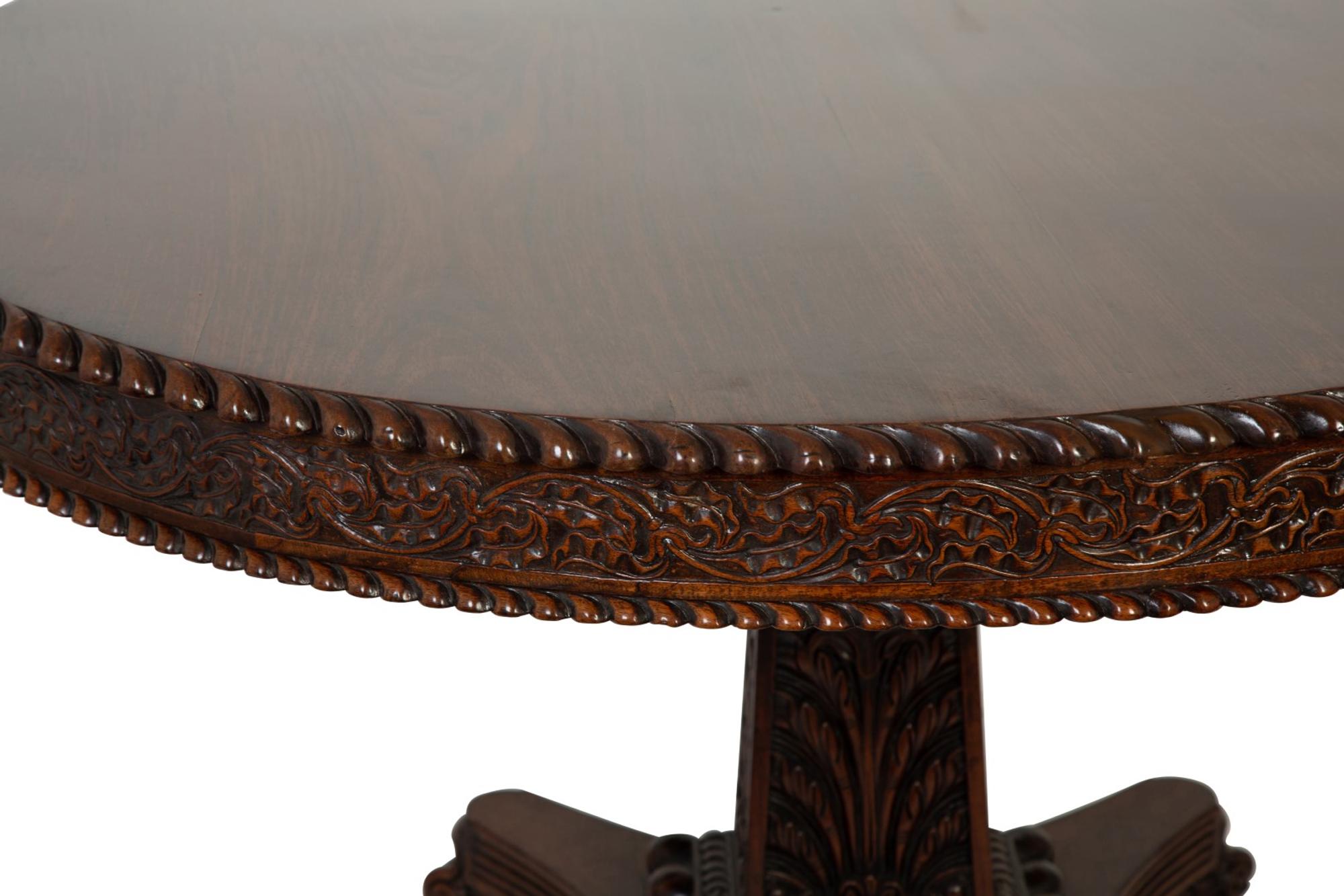 An Anglo-Indian Carved Padouk Wood Tilt Top Center Table — 19TH CENTURY