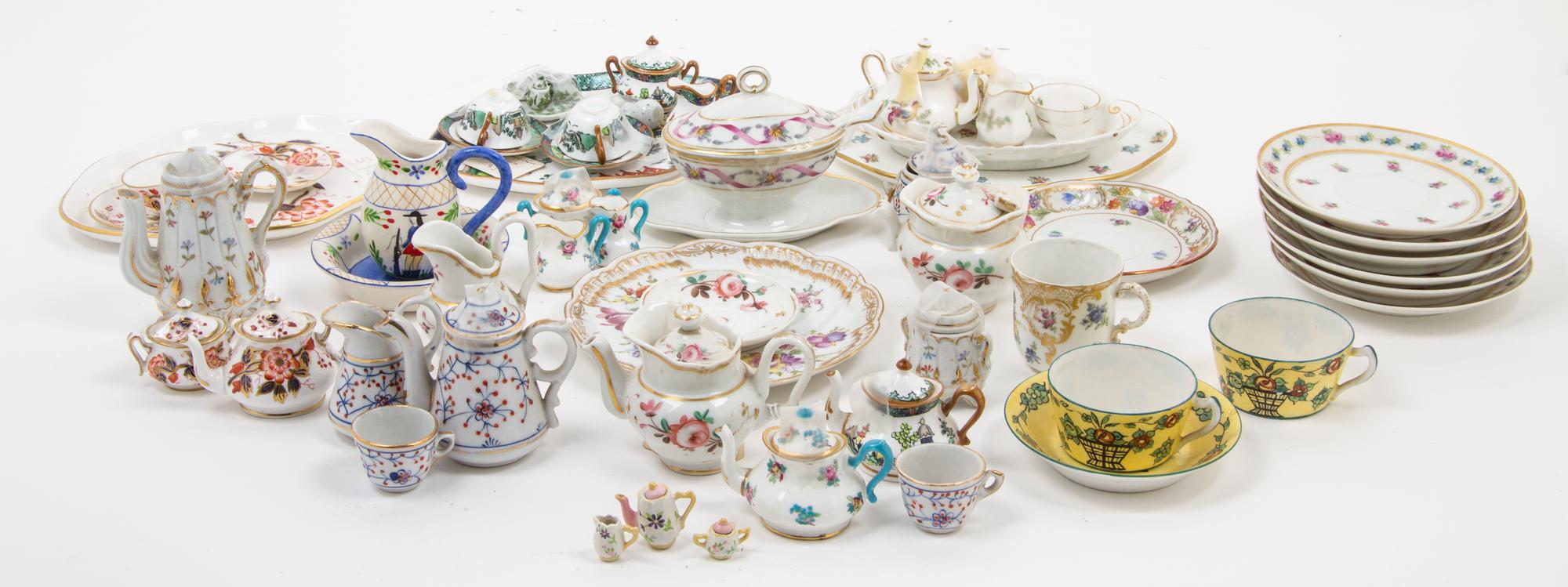 A Large Collection of Miniature Porcelain Tea Articles Width of widest 7 inches.