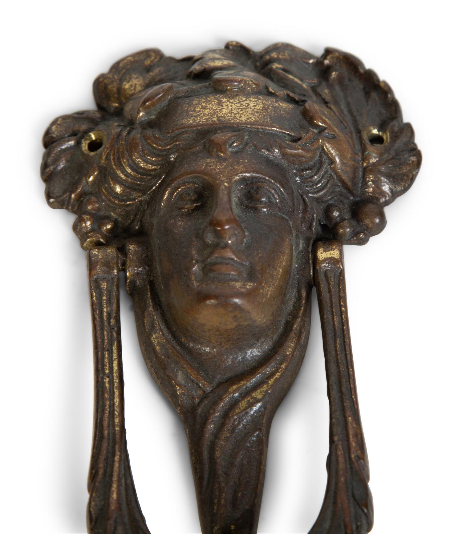 A Group of Three Continental Patinated Metal Door Knockers — 19TH CENTURY