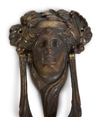 A Group of Three Continental Patinated Metal Door Knockers — 19TH CENTURY