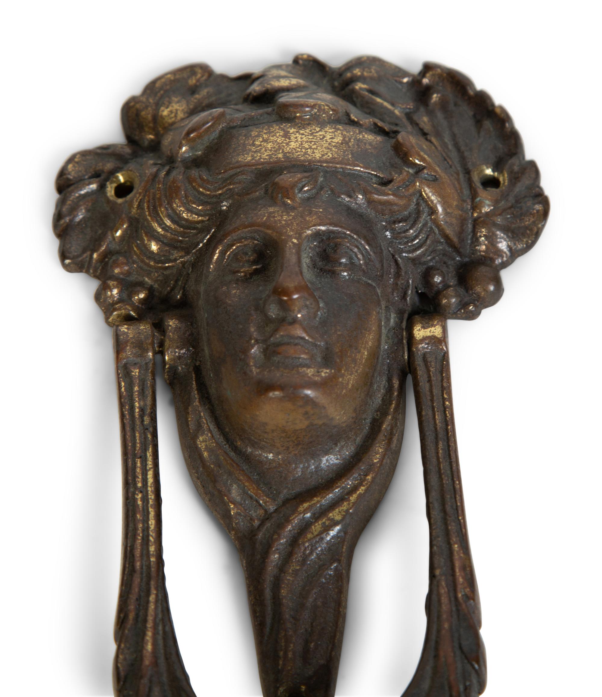 A Group of Three Continental Patinated Metal Door Knockers — 19TH CENTURY