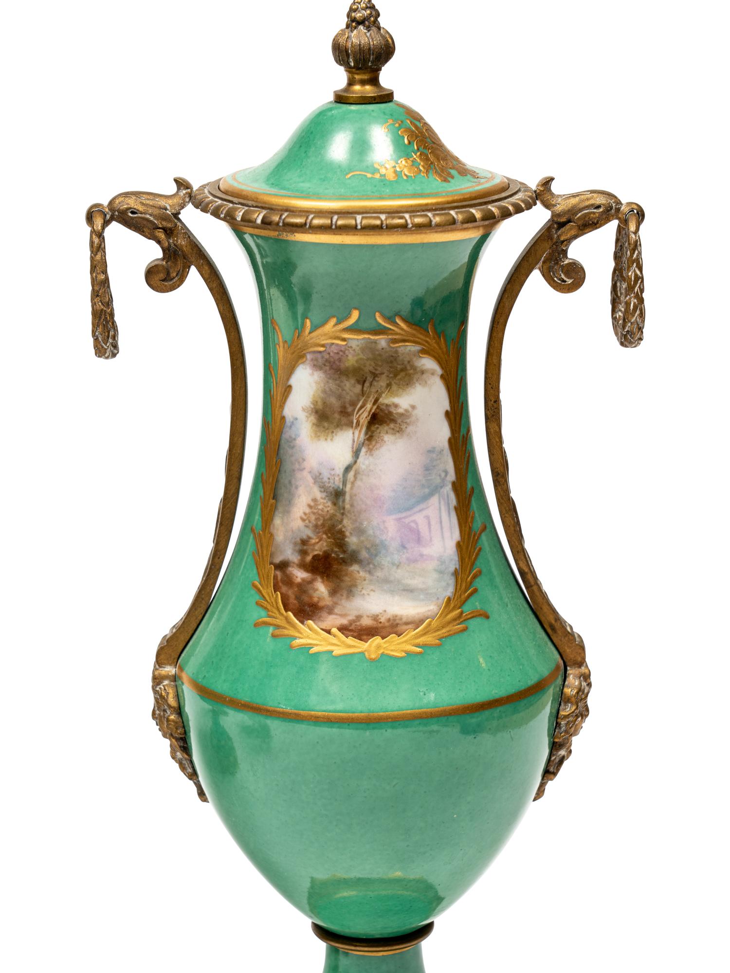 A Gilt Metal Mounted Sèvres Style Porcelain Three-Piece Garniture