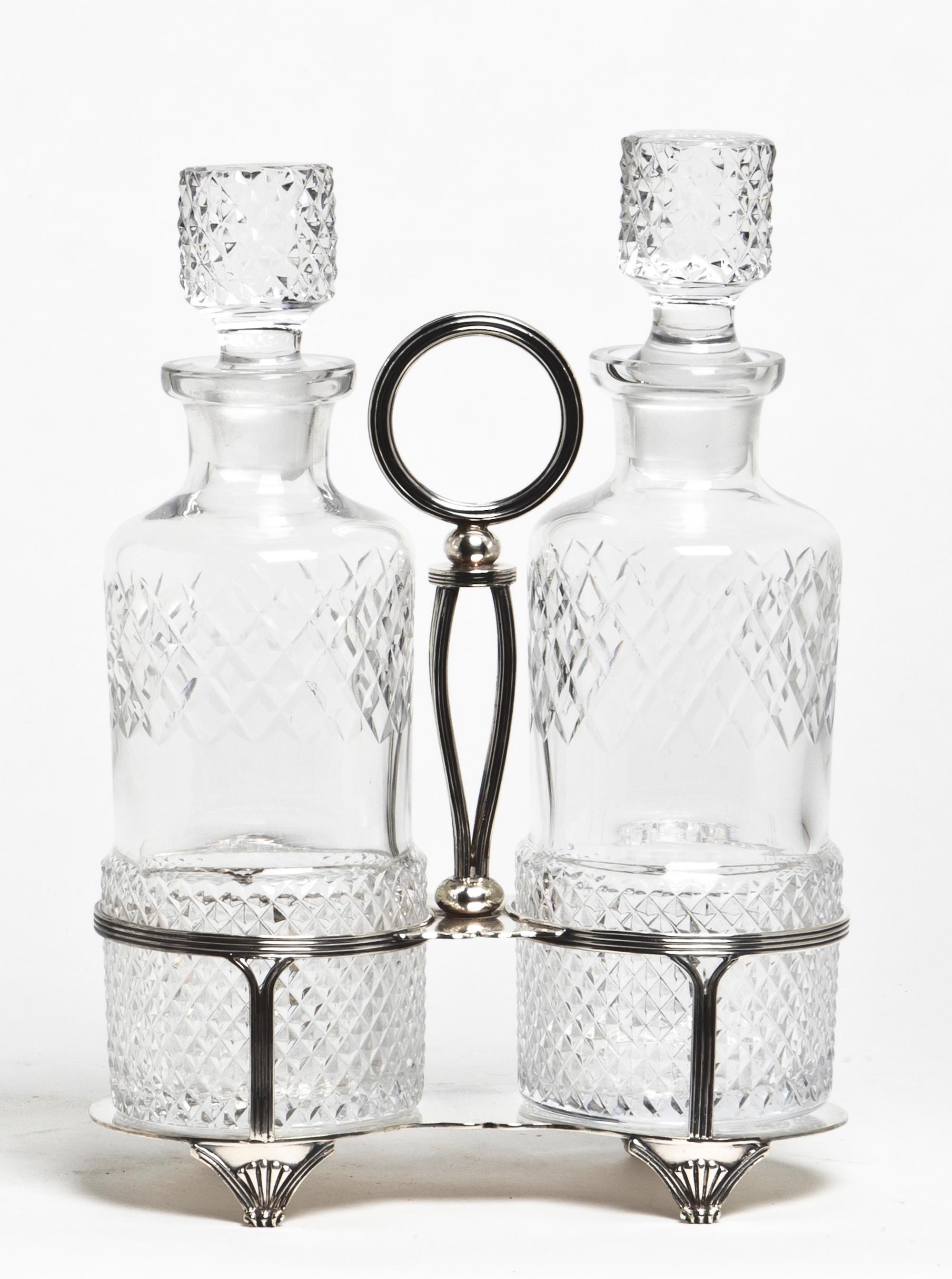 A Victorian Silver-plate Decanter Set, Martin, Hall & Co., Sheffield, England Height 12 x width 8 1/2 x depth 4 inches.