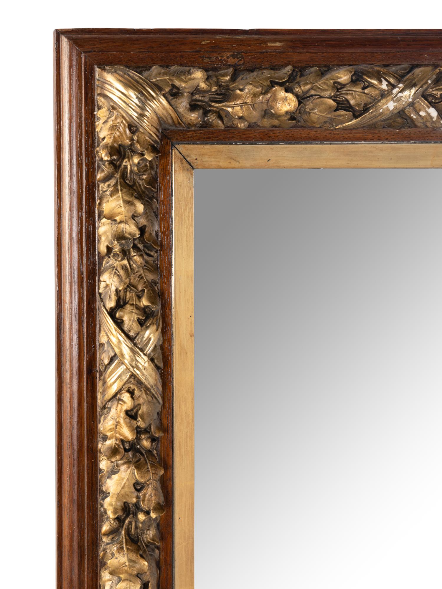 A French Carved and Parcel-Gilt Walnut Mirror