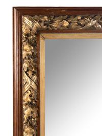 A French Carved and Parcel-Gilt Walnut Mirror