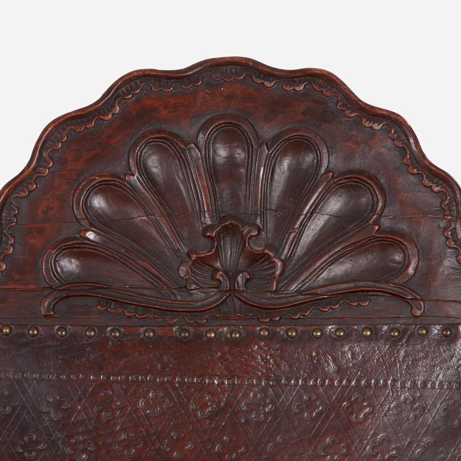 A carved mahogany and tooled leather Campeche chair Mexico, late 18th / early 19th century