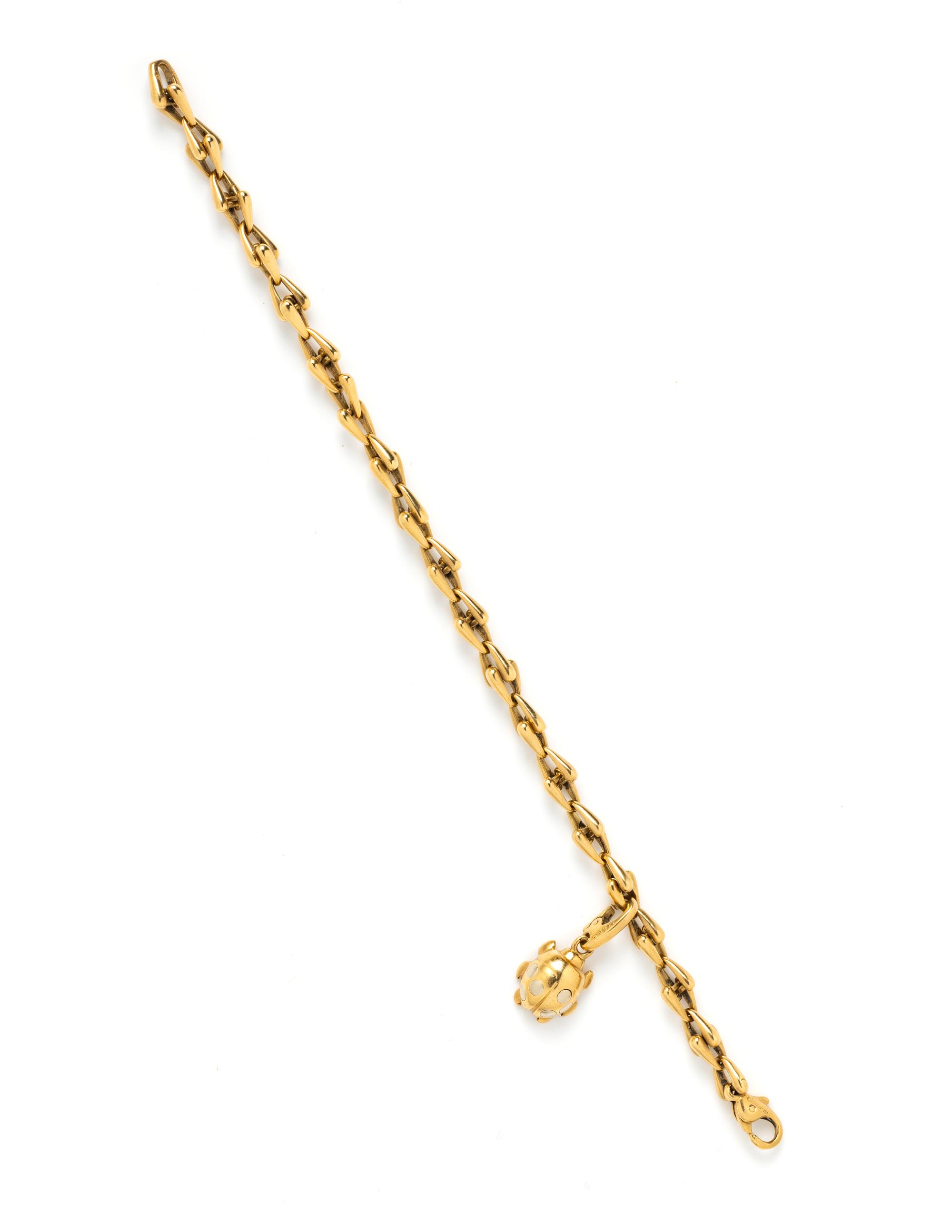 CARTIER, YELLOW GOLD BRACELET AND LADYBUG CHARM