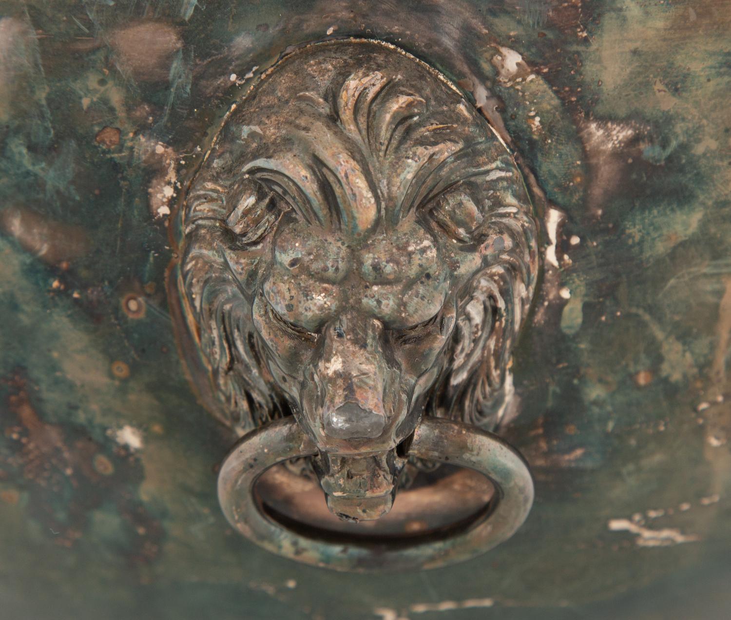 An Assembled Trio of Silverplate Footed Punch Bowls with Lionhead Handles