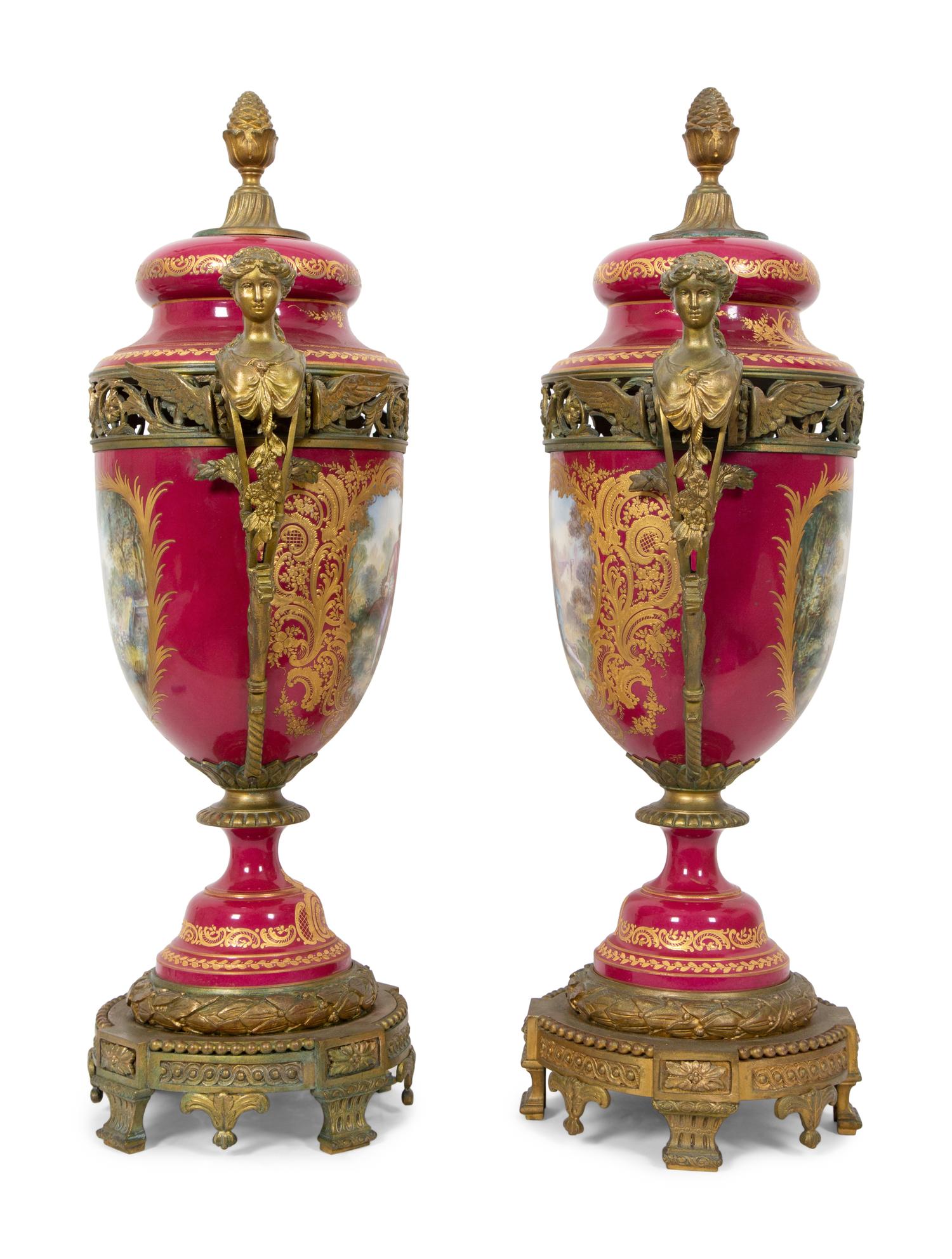 A Pair of Gilt Bronze Mounted Sevres Style Porcelain Covered Urns