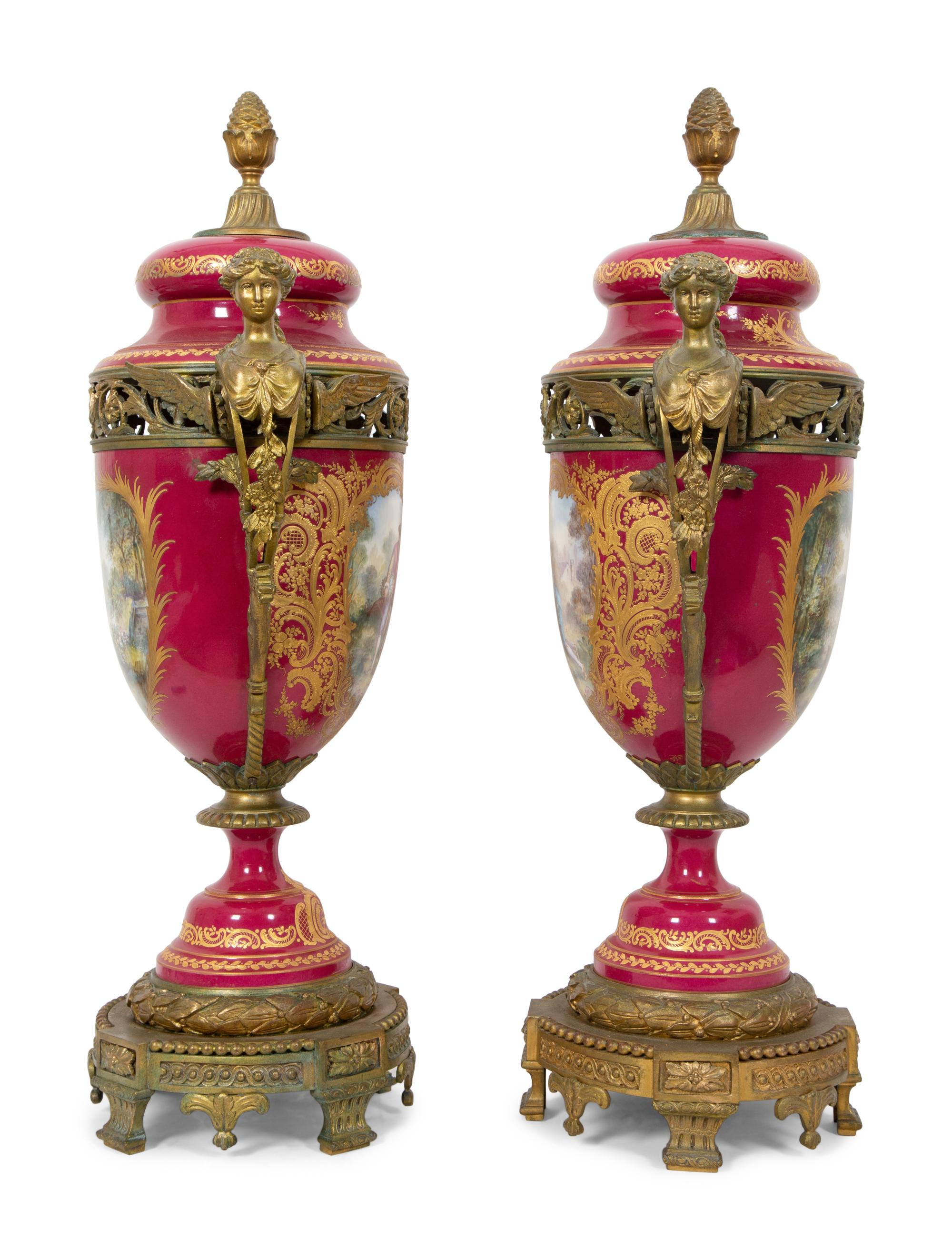 A Pair of Gilt Bronze Mounted Sevres Style Porcelain Covered Urns