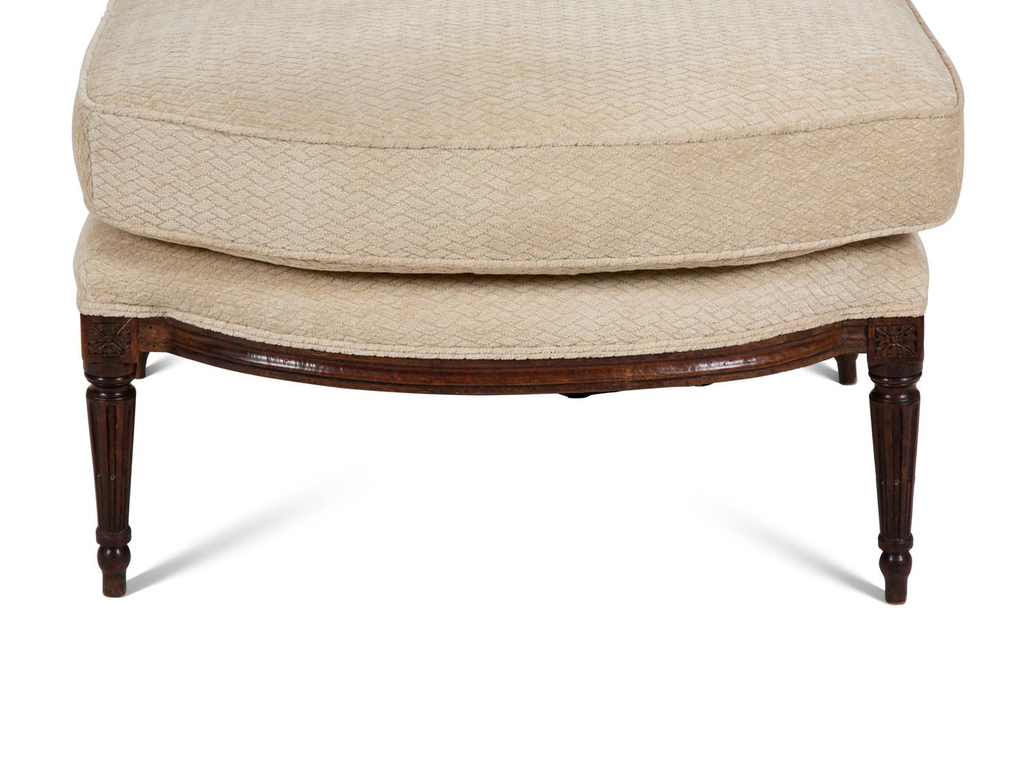 A Louis XVI Carved Walnut Chaise Longue