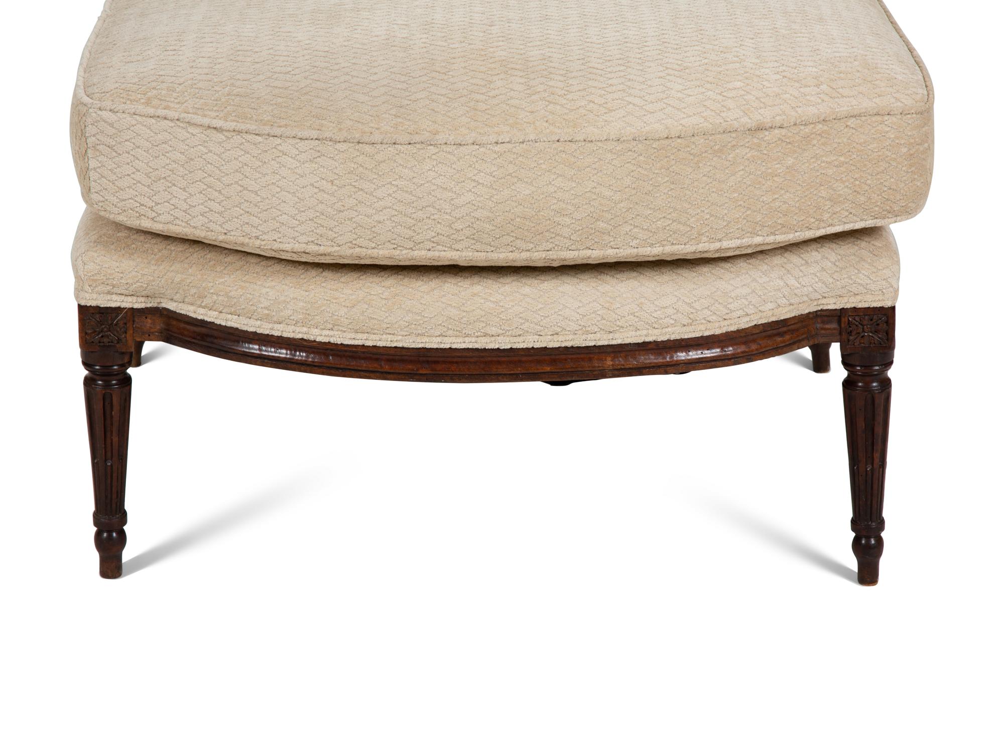 A Louis XVI Carved Walnut Chaise Longue
