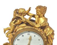 A Louis XVI Style Gilt-Bronze Mounted Rouge Marble Mantel Clock
