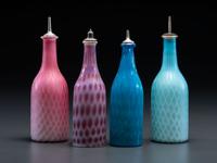 Four Opalescent Glass Barber Bottles