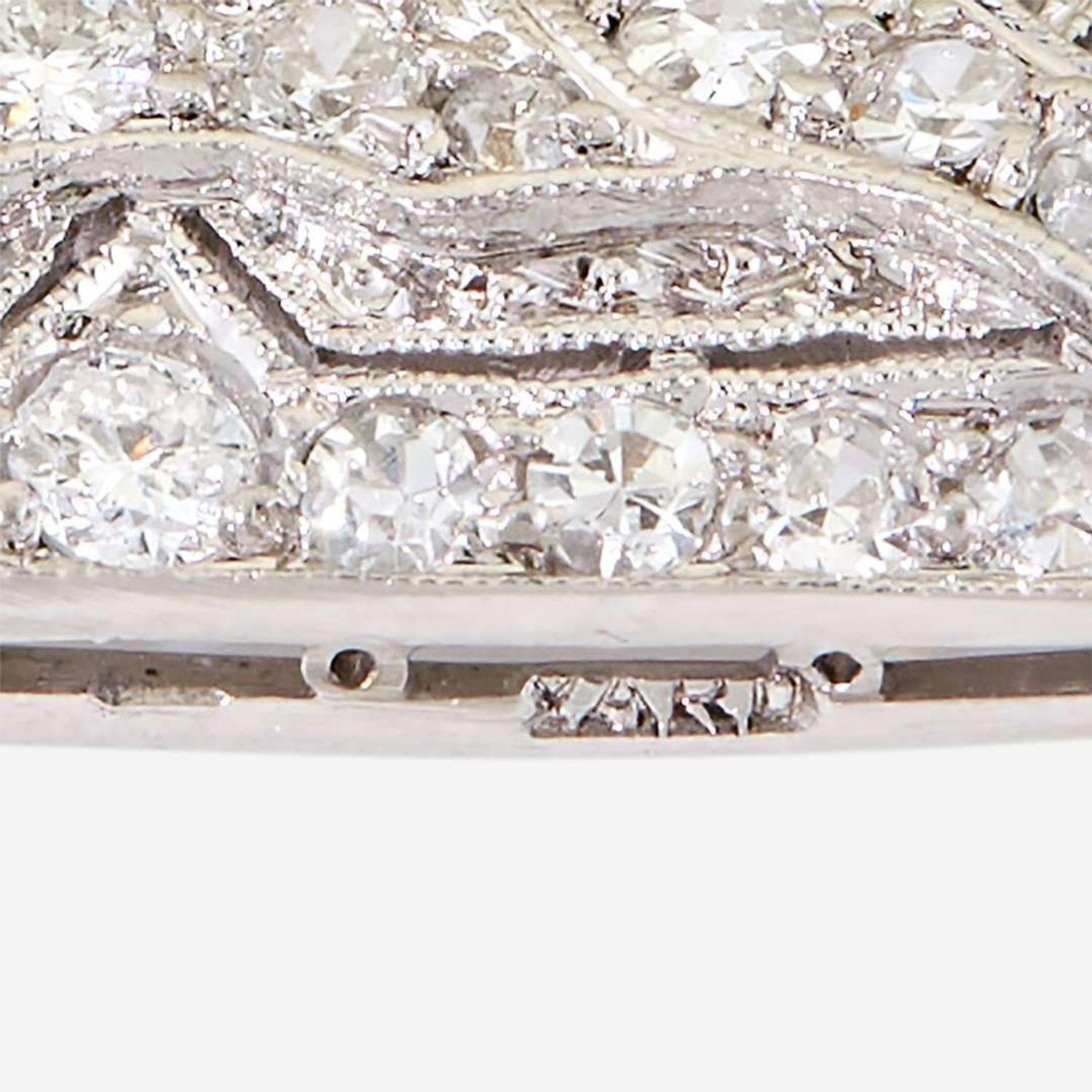 A yellow diamond, diamond, zircon, and fourteen karat white gold pendant/brooch, Raymond Yard