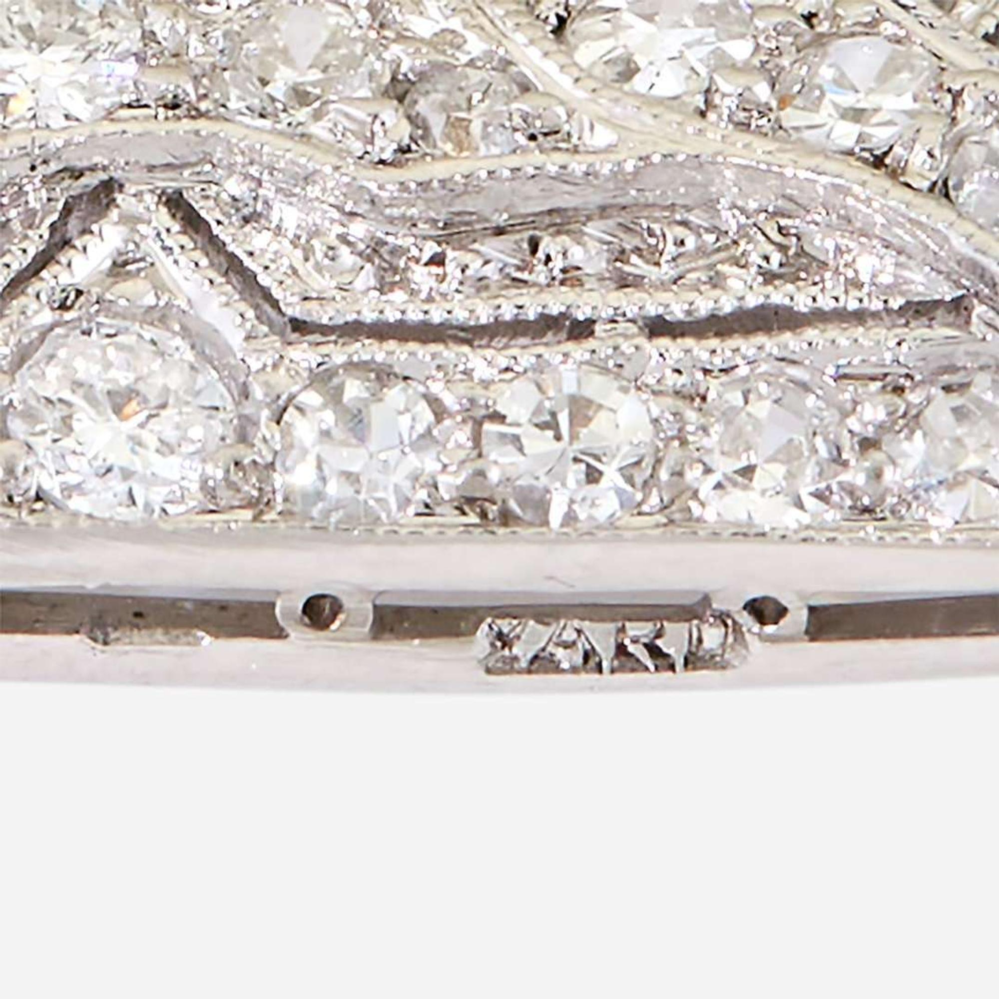 A yellow diamond, diamond, zircon, and fourteen karat white gold pendant/brooch, Raymond Yard