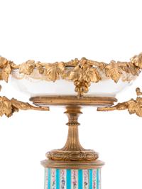 A Pair of Sèvres Style Gilt Bronze Mounted Painted and Parcel Gilt Porcelain Tazze