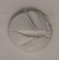 A Minoan Green Jasper Lentoid with a Flying Fish