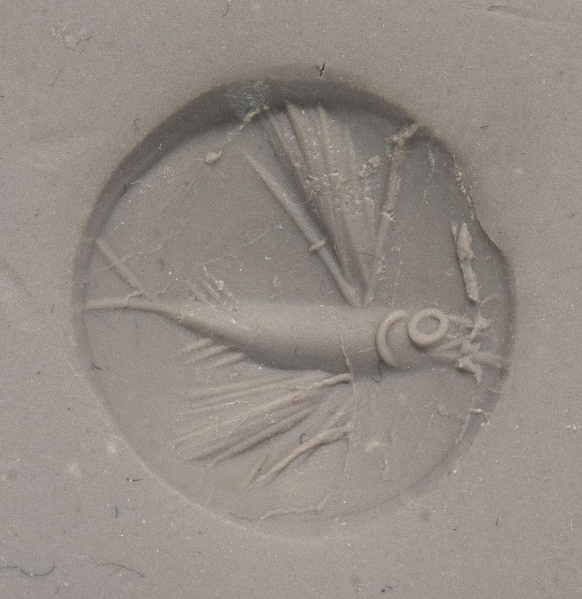 A Minoan Green Jasper Lentoid with a Flying Fish