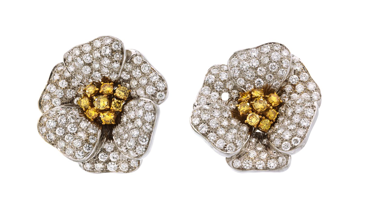 A Pair of 18 Karat Two Tone Gold, Colored Diamond and Diamond Flower Earclips, 23.80 dwts.