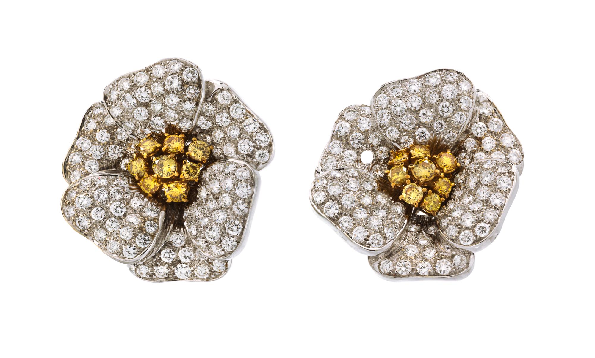 A Pair of 18 Karat Two Tone Gold, Colored Diamond and Diamond Flower Earclips, 23.80 dwts.