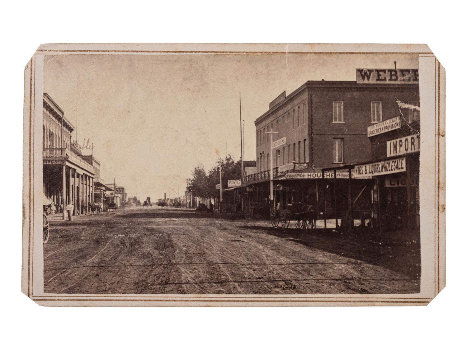 [WESTERN AMERICANA - CALIFORNIA]. STUART, W.M., photographer. CDV of street in Sacramento, California. Stockton, CA: n.d.