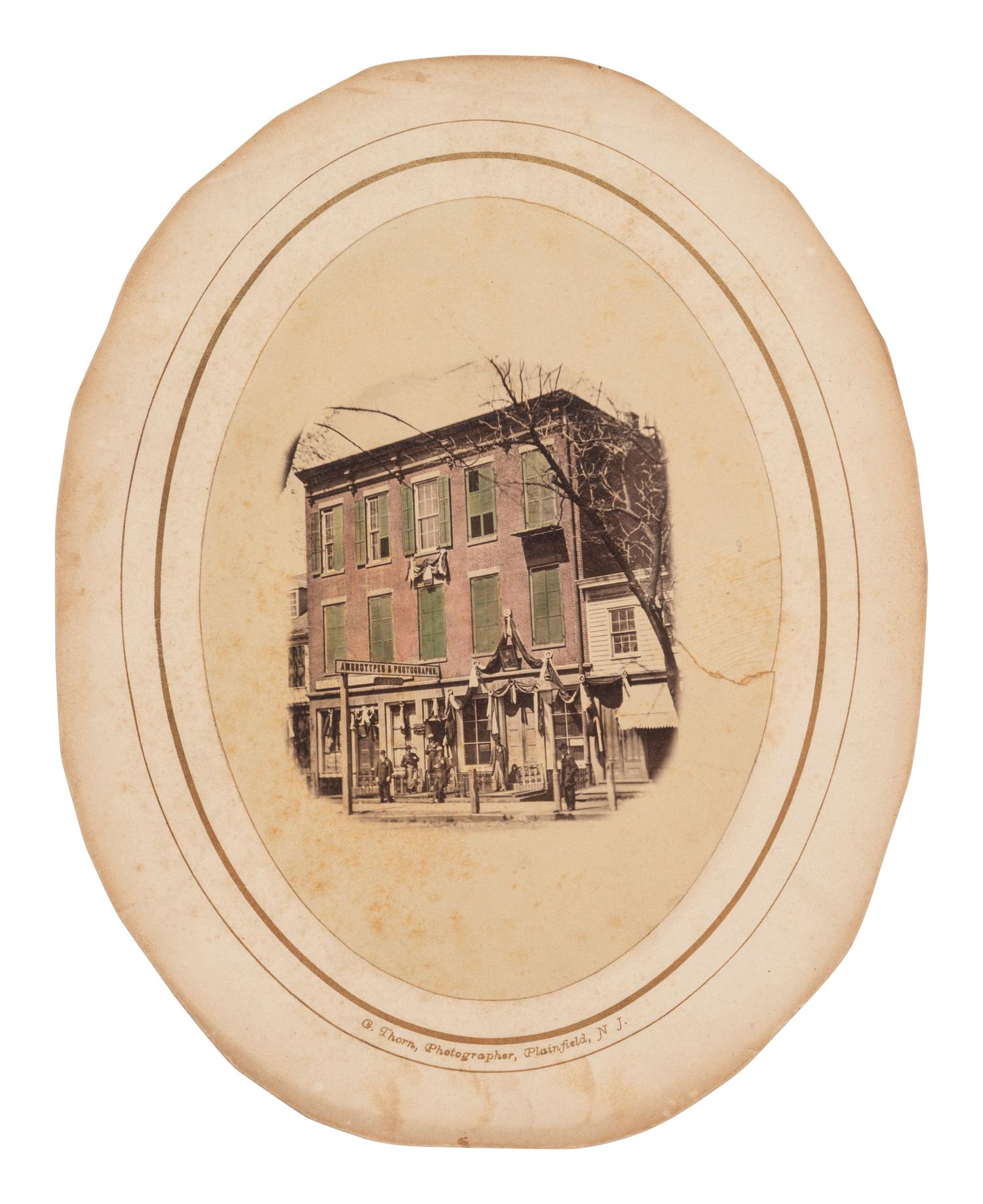 [EARLY PHOTOGRAPHY] Albumen photograph of "Ambrotypes & Photographs" studio, possibly in New Jersey.