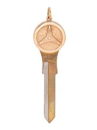 A 14 Karat Yellow Gold and Metal Car Blank Key Pendant,
