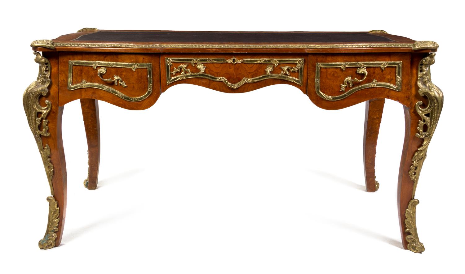 A Louis XV Style Gilt Metal Mounted Burlwood Bureau Plat, Height 31 3/4 x width 59 1/2 x depth 32 1/2 inches.