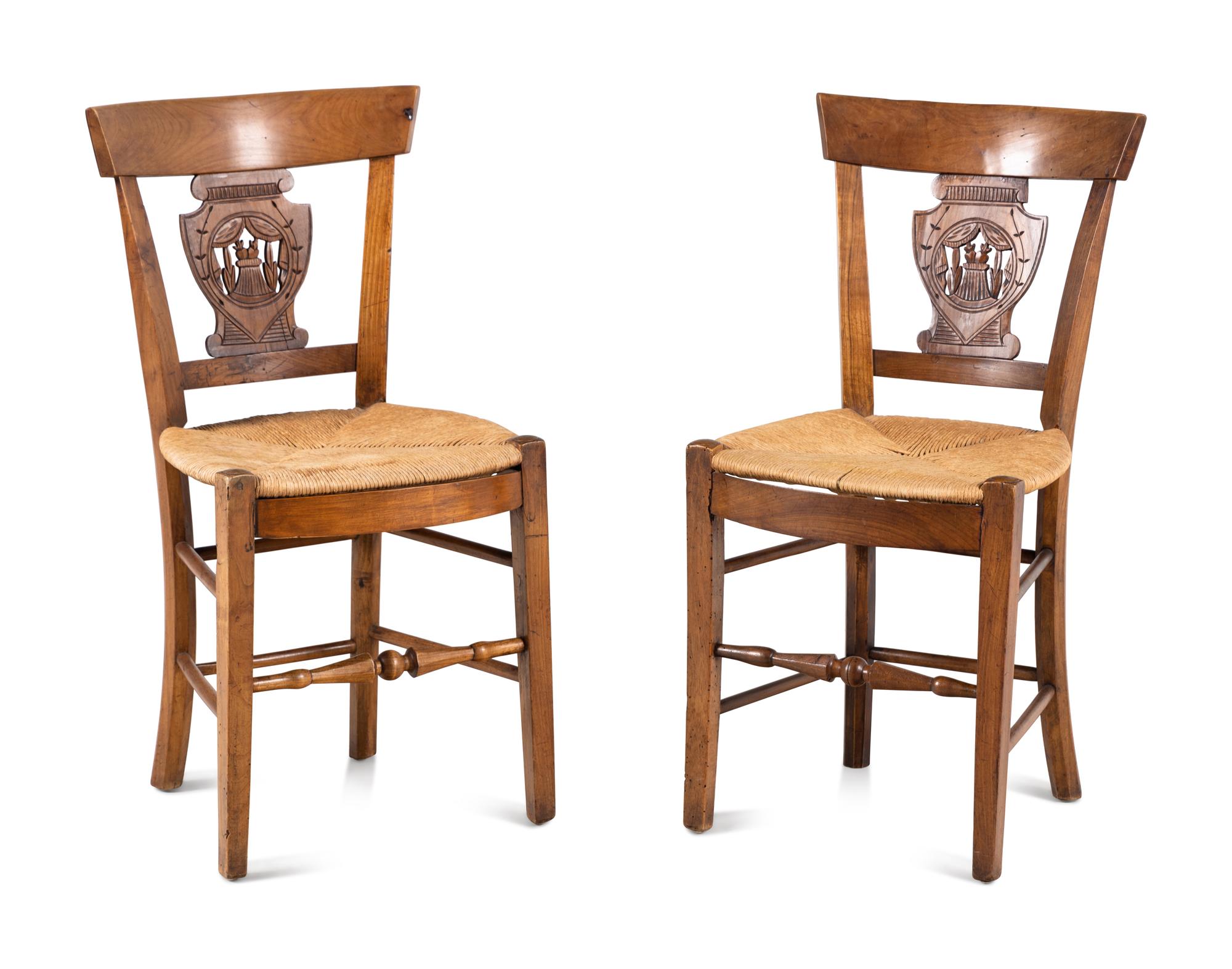 A Pair of Directoire Carved Walnut Rush-Seat Side Chairs
