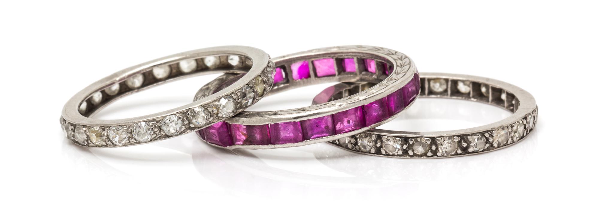 A Collection of Platinum, Diamond and Pink Sapphire Eternity Bands, 4.80 dwts.